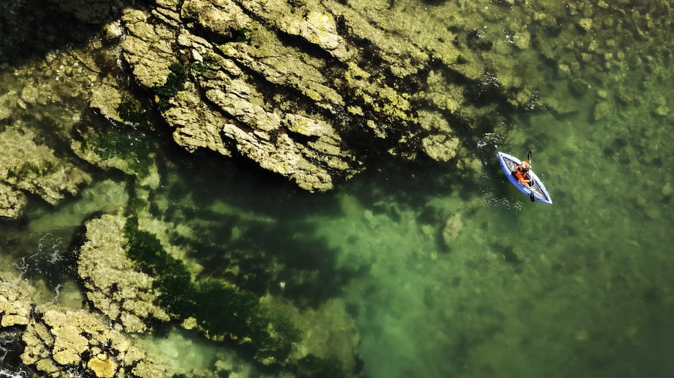 Birds eye view of Sam Philip kayaking in the North Landing in Yorkshire